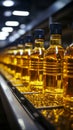 Factory conveyor line filling bottles with sunflower and vegetable oil in close up