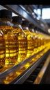 Factory conveyor line filling bottles with sunflower and vegetable oil in close up