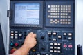 Factory engineer controlling and pressing important technology button at control panel. Royalty Free Stock Photo