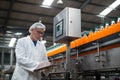 Factory engineer maintaining record on clipboard in factory Royalty Free Stock Photo