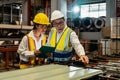 Factory engineer conduct quality control on metal product. Exemplifying Royalty Free Stock Photo