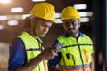 Factory engineer worker reading bad news lay off notify at smartphone serious worry expression