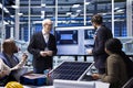 Factory executives discuss solar panel research and development strategies Royalty Free Stock Photo