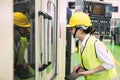 Factory female worker inspect machine Royalty Free Stock Photo