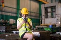 Factory female worker using phone during break Royalty Free Stock Photo