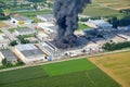 Factory fire with black smoke that causes pollution