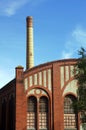 Factory floor and smokestack in old gasworks Royalty Free Stock Photo