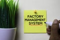 Factory Management System text on sticky notes isolated on office desk
