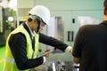 Factory manager check command worker to use lathe machine robot Royalty Free Stock Photo