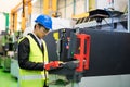 Factory manager use computer for productivity