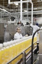 Factory men working in a bottling plant