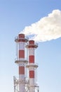 Factory plant smoke stack over blue sky background. Thermal condensing power plant. Royalty Free Stock Photo