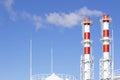 Factory plant smoke stack over blue sky background. Thermal condensing power plant. Energy generation and air environment pollutio Royalty Free Stock Photo