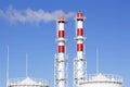 Factory plant smoke stack over blue sky background. Thermal condensing power plant. Energy generation and air environment pollutio