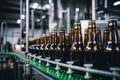 Factory for the production of beer. Brewery conveyor with glass beer drink alcohol bottles, modern production line. Blurred Royalty Free Stock Photo