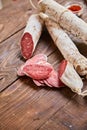 Factory for the production of meat products, boiled-smoked and dried sausages. Traditional spicy sausage, ready to eat, lies slice Royalty Free Stock Photo