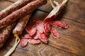 Factory for the production of meat products, boiled and smoked sausages. Traditional spicy sausage, ready to eat, lies sliced on a Royalty Free Stock Photo