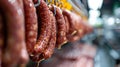 Factory for the production of meat products, cured sausages. Traditional spicy sausage hanging to dry, covered with Royalty Free Stock Photo