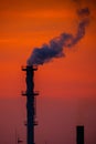 The factory released smoke chimney in sunset. Global warming concept Royalty Free Stock Photo