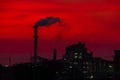 The factory released smoke chimney in sunset. Global warming concept Royalty Free Stock Photo