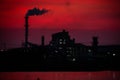 The factory released smoke chimney in sunset. Global warming concept Royalty Free Stock Photo