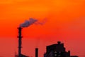 The factory released smoke chimney in sunset. Global warming concept Royalty Free Stock Photo