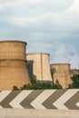 The factory releases smoke into the sky from pipes polluting the atmosphere