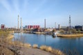 Factory site with chimney and lake