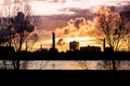 Factory with smokestacks at sunset