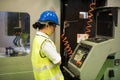 Factory technician woman check machine Royalty Free Stock Photo