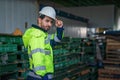 Factory warehouse foreman and supervisor in front of wearhouse pallets storage