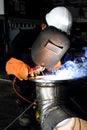 Factory welder doing his hard job