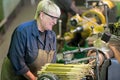 Factory woman turner working on workshop lathe machine Royalty Free Stock Photo