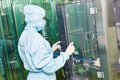 Factory woman worker operating production line