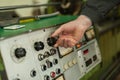 Factory worker adjusts the control panel of industry machine Royalty Free Stock Photo