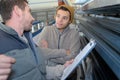 factory worker discussing data with supervisor in metal factory Royalty Free Stock Photo