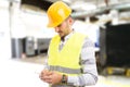 Factory worker employee chatting browsing texting on smartphone
