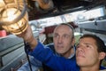 Factory worker fixing light bulp Royalty Free Stock Photo