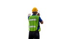 Factory worker in hard hat and safety vest talks on two-way radio, man with clipping path on white background
