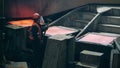 Factory worker is hitting solidifying copper in the molds