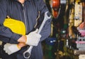 The factory worker holding a hard hat and a wrench Royalty Free Stock Photo