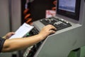 Factory worker on keyboard to command machine Royalty Free Stock Photo