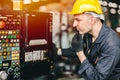 Factory worker man operate the machine, high skill labor work industry with safety clothes Royalty Free Stock Photo