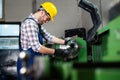 Factory worker measure detail with digital caliper micrometer during finishing metal working on lathe machine Royalty Free Stock Photo