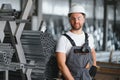 Factory worker measures the metal profile Royalty Free Stock Photo