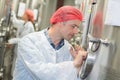 Factory worker with metal vat Royalty Free Stock Photo