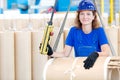 Factory worker moving transformer coil with overhead crane Royalty Free Stock Photo