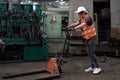 Factory worker with pallet jack Royalty Free Stock Photo