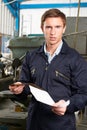 Factory Worker Reading Redundancy Letter