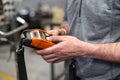 Factory worker. Technician controlling a heavy crane in factory, close up at his hands holding a crane controller. Royalty Free Stock Photo